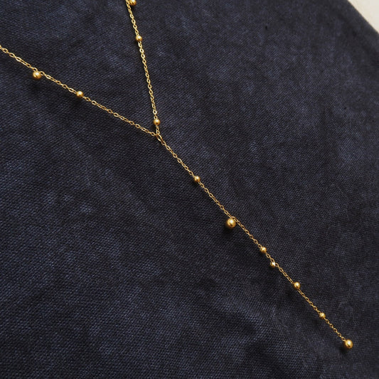 Y-shaped Necklace With A Tassel Pendant And Round Beads